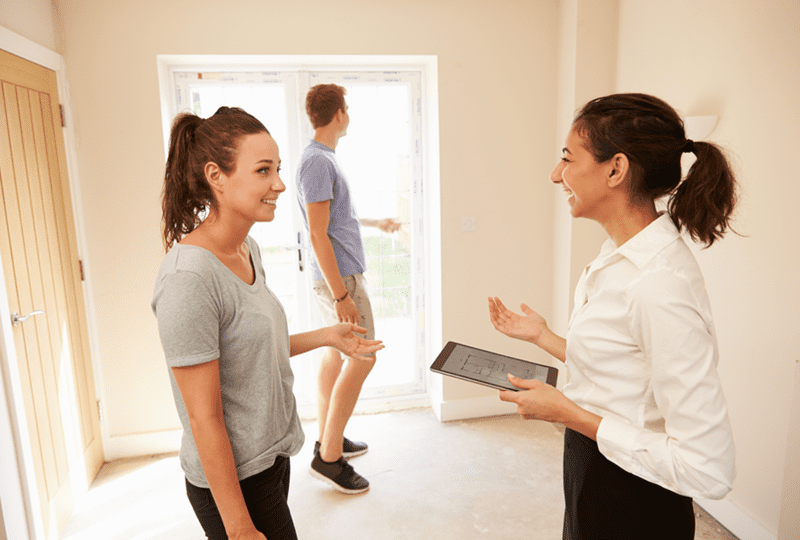 Home seller speaking with a female real estate agent